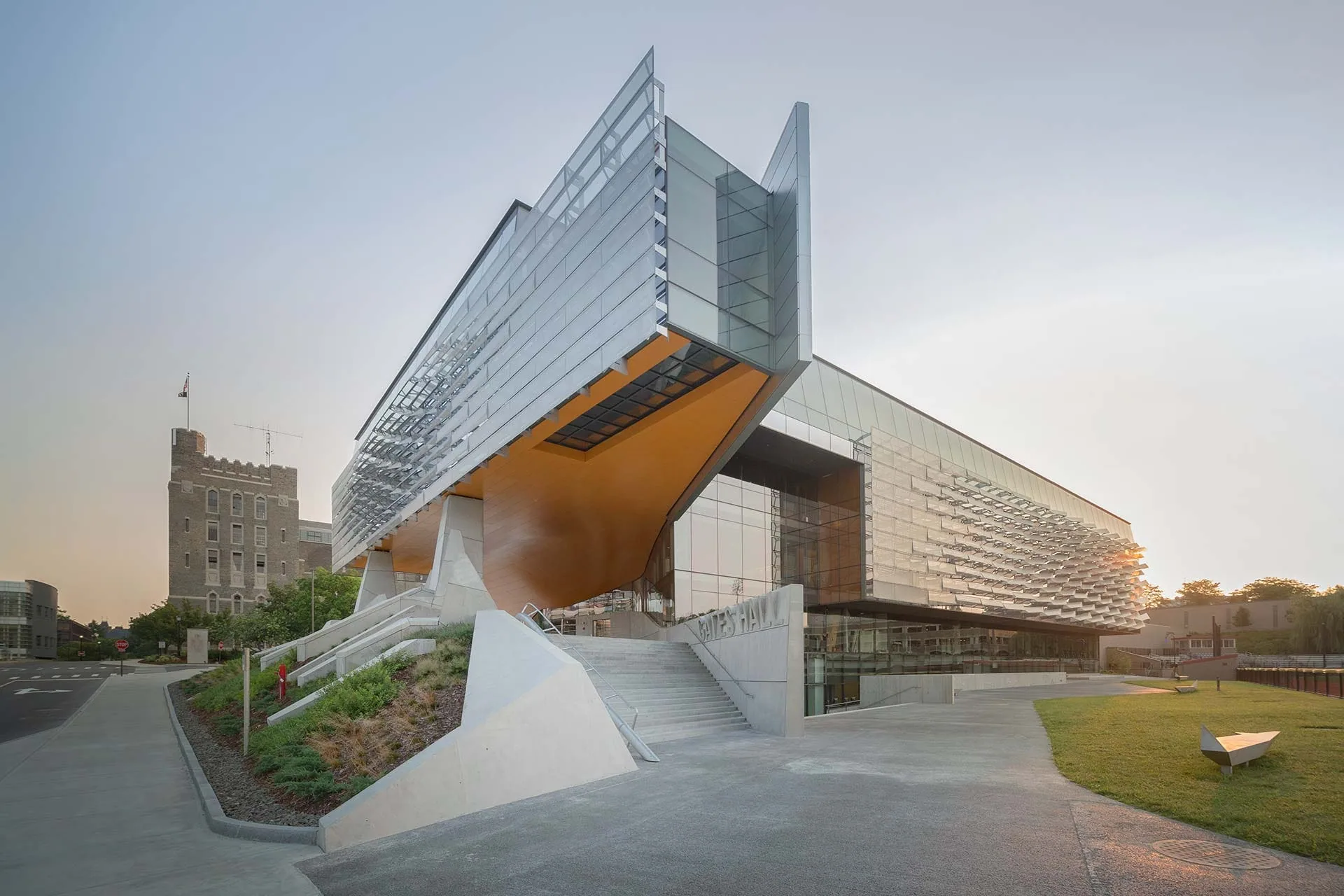 A stainless steel soffit cantilevered over a plaza