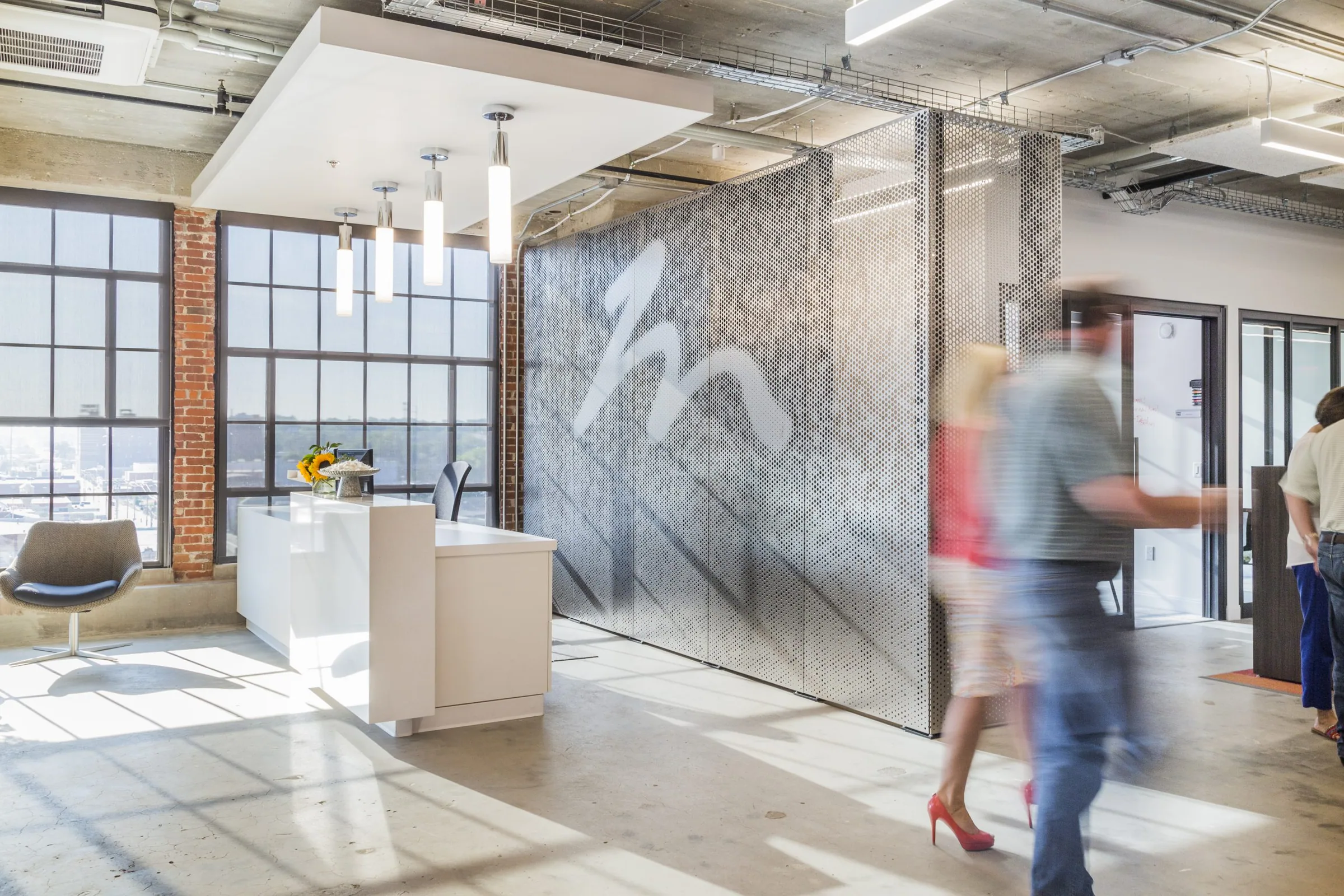 An office lobby with a sculpted metal wall
