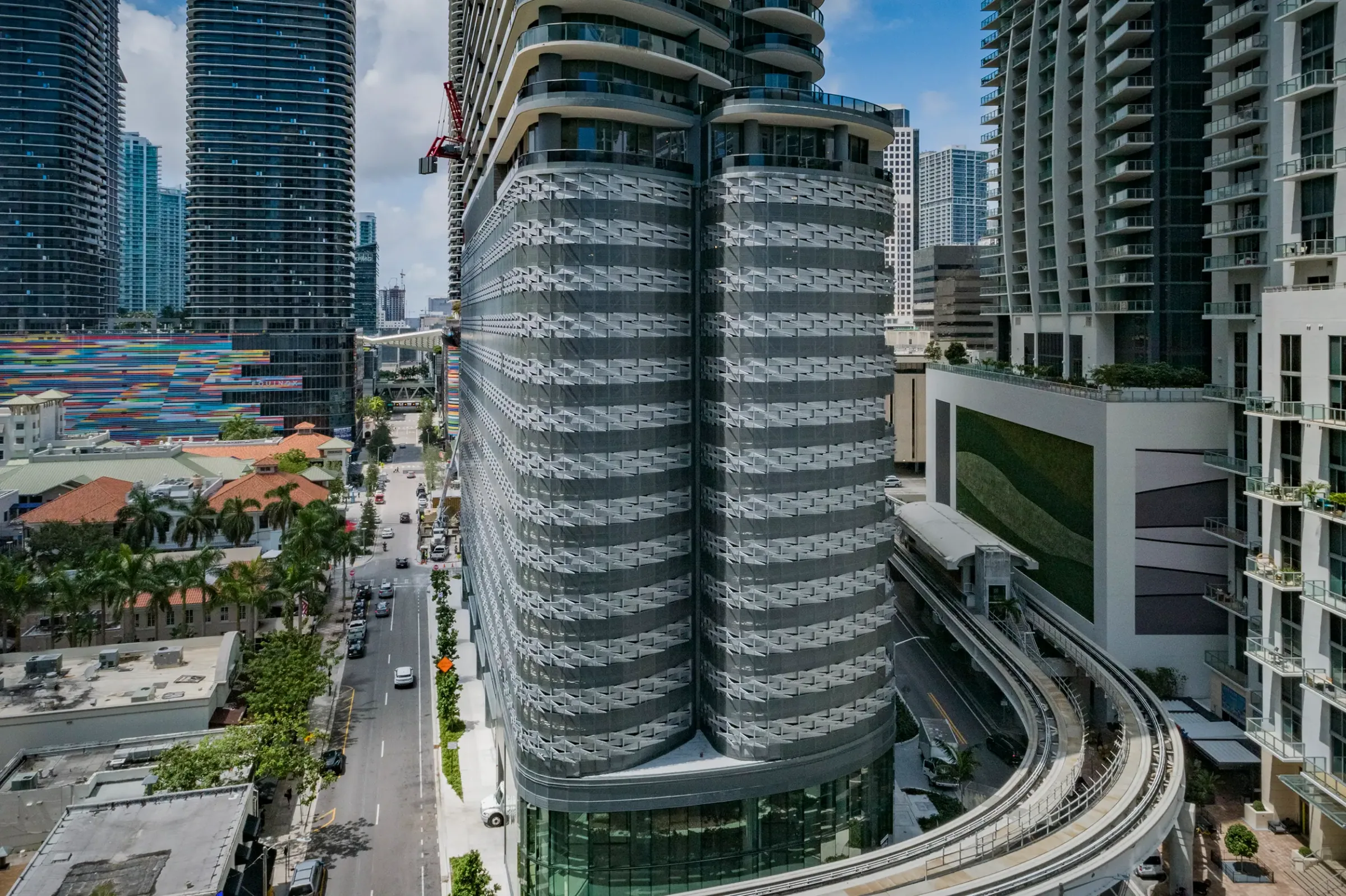 Brickell Flatiron tower above a Miami street