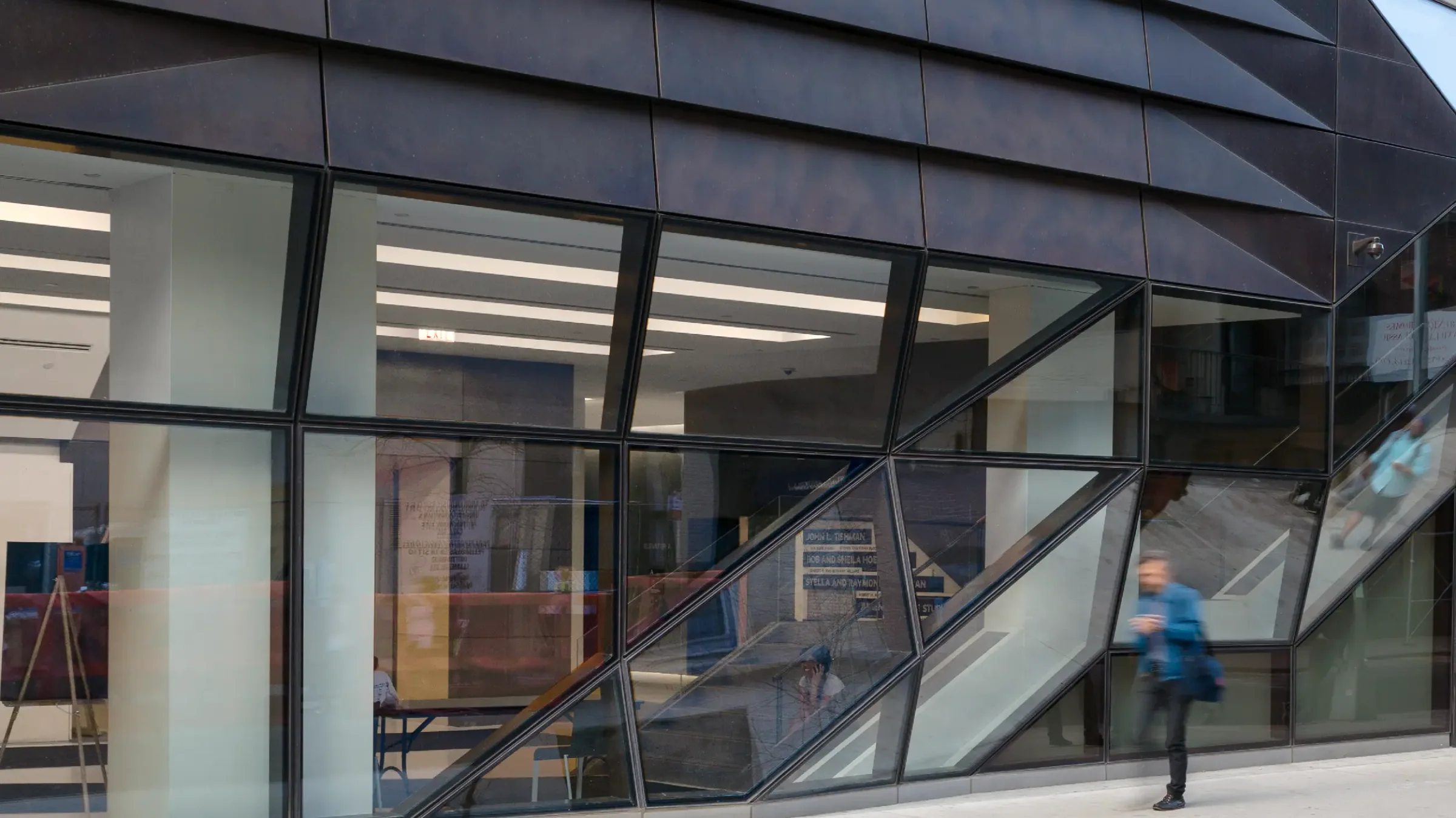 Angled glass curtain wall at street level