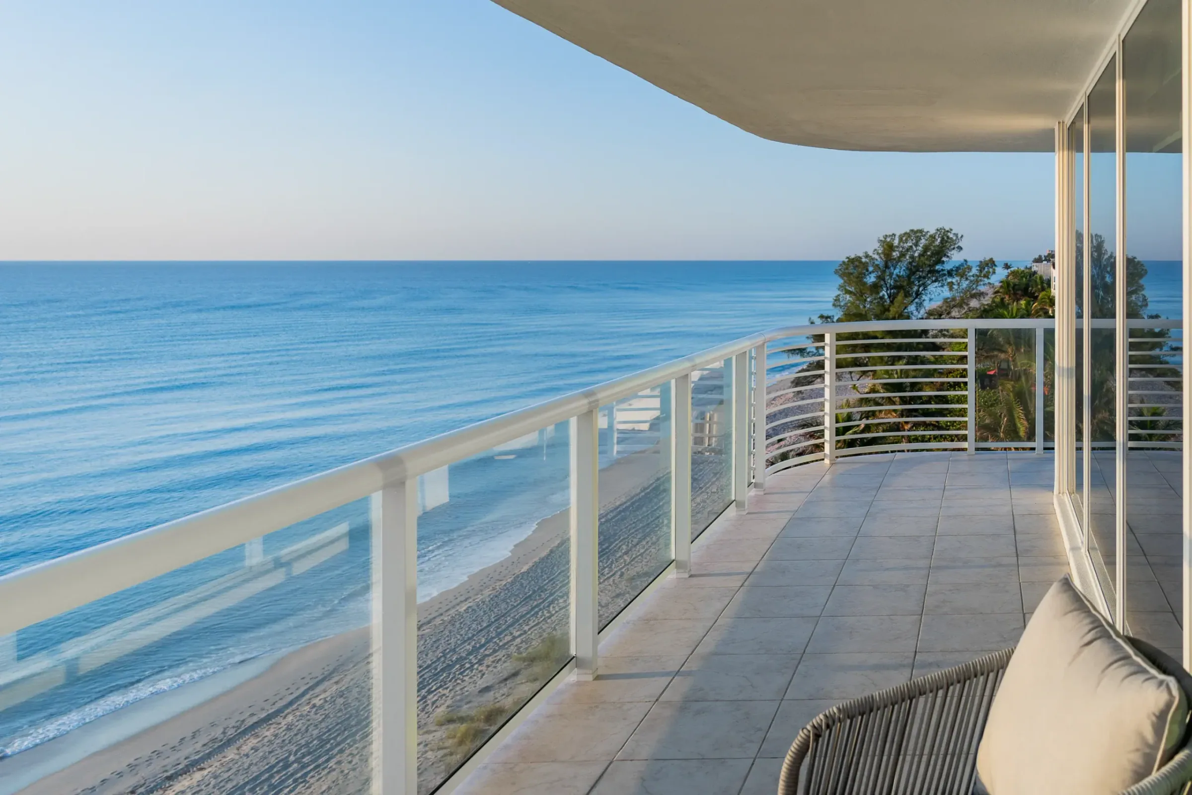 Glass balcony railings on a white tower