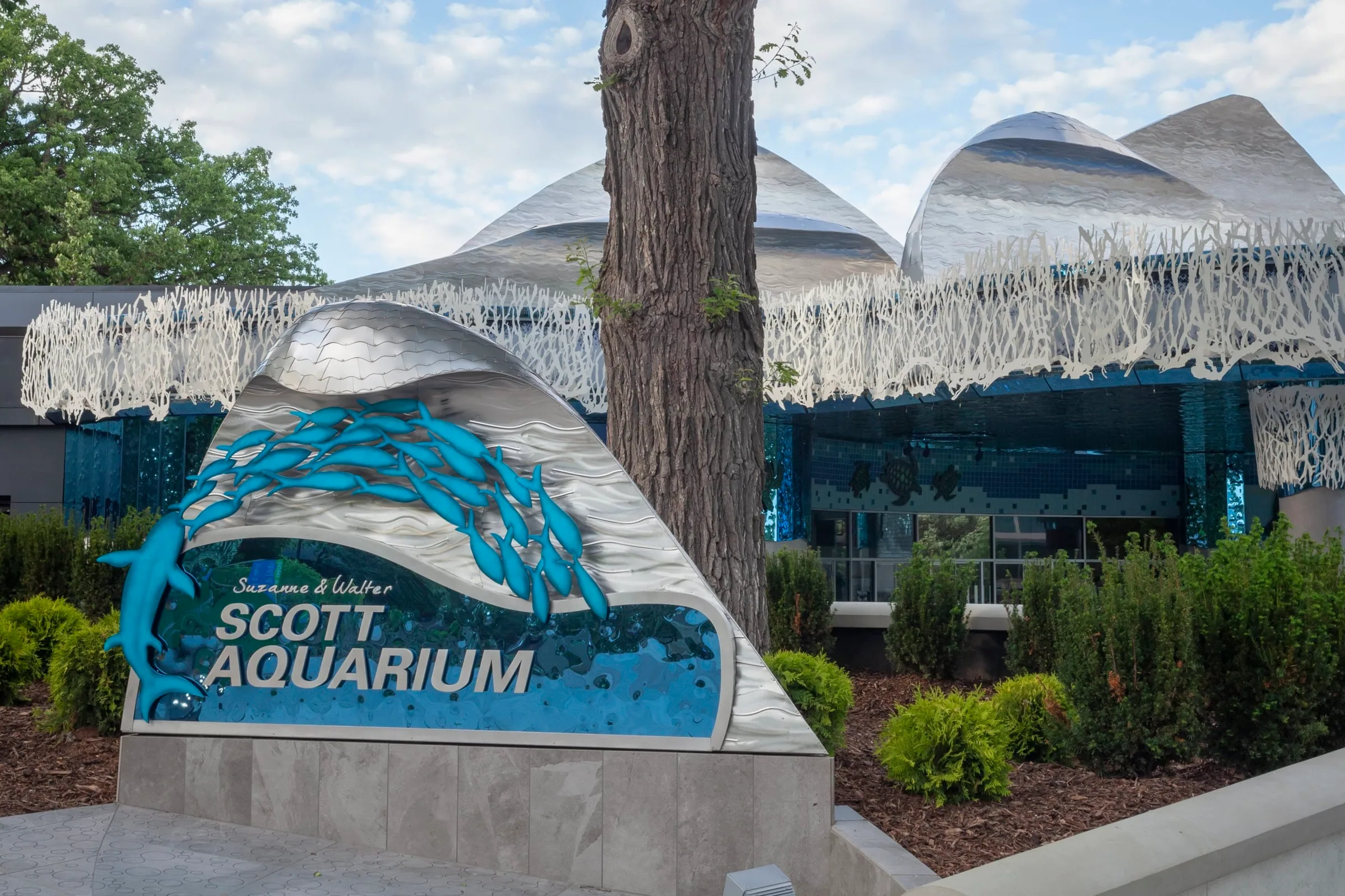 The Scott Aquarium entrance sign under the wave façade