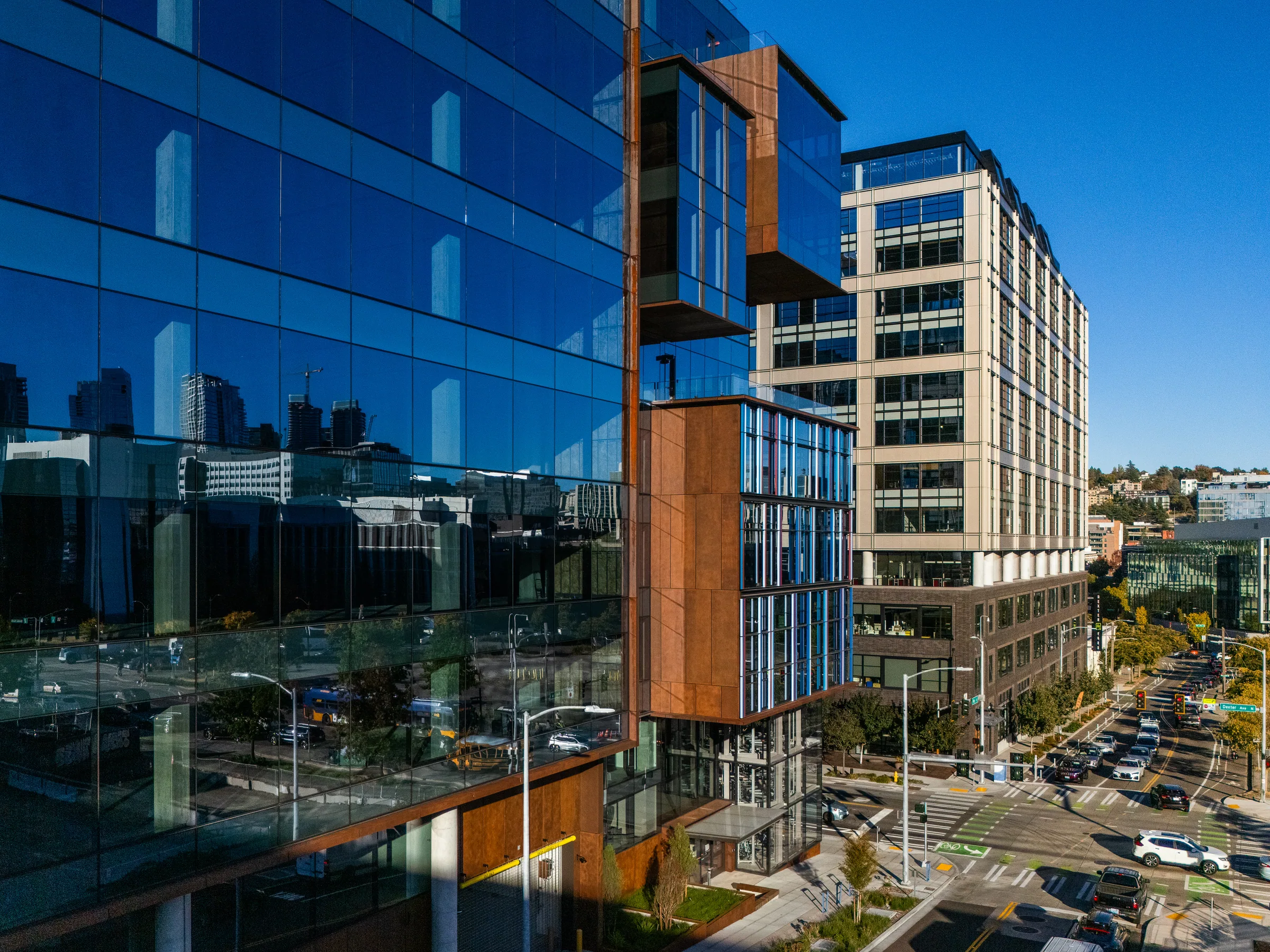 Glass boxes and steel panels from above, Lake Union streets beyond