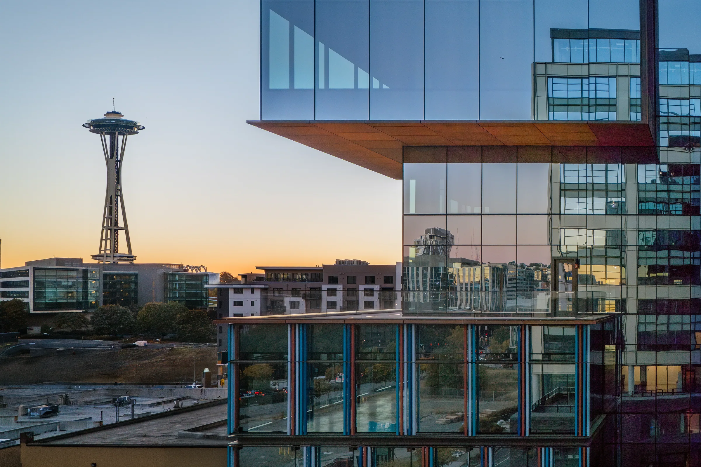 The Space Needle beyond a cantilevered corner at sunset