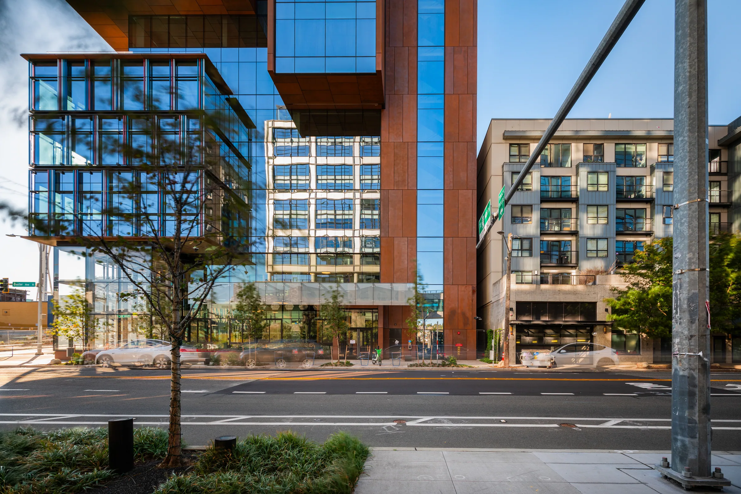 Steel-clad bays and a glass lobby across Dexter Avenue