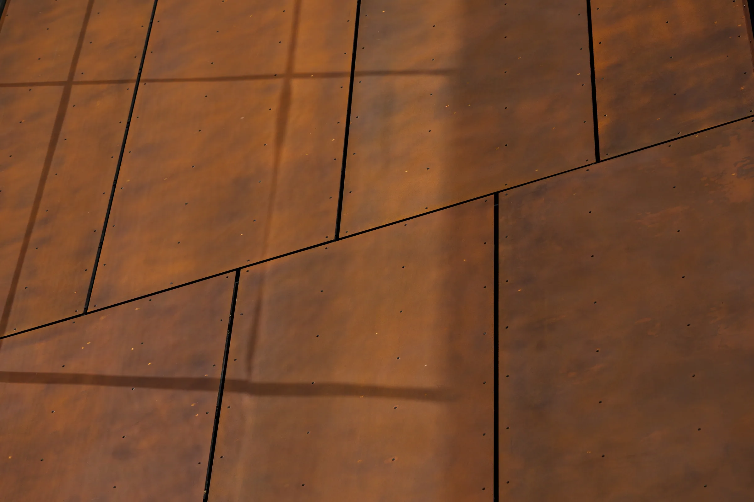 Shadow lines across flush steel panels