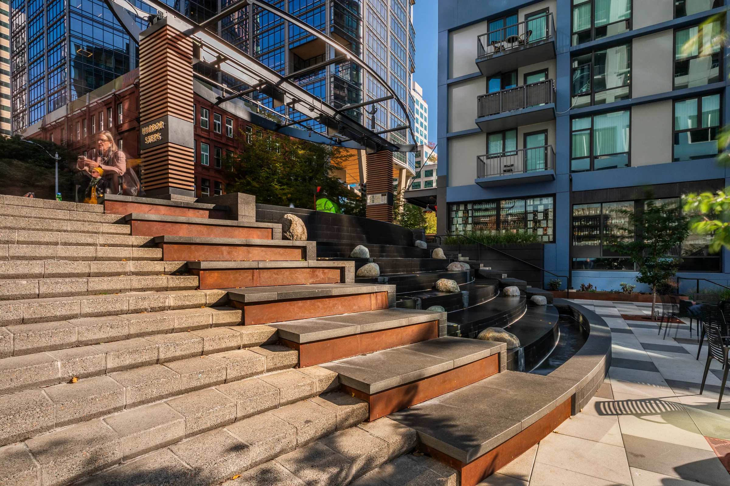 A wide flight of granite steps with steel-edged landings