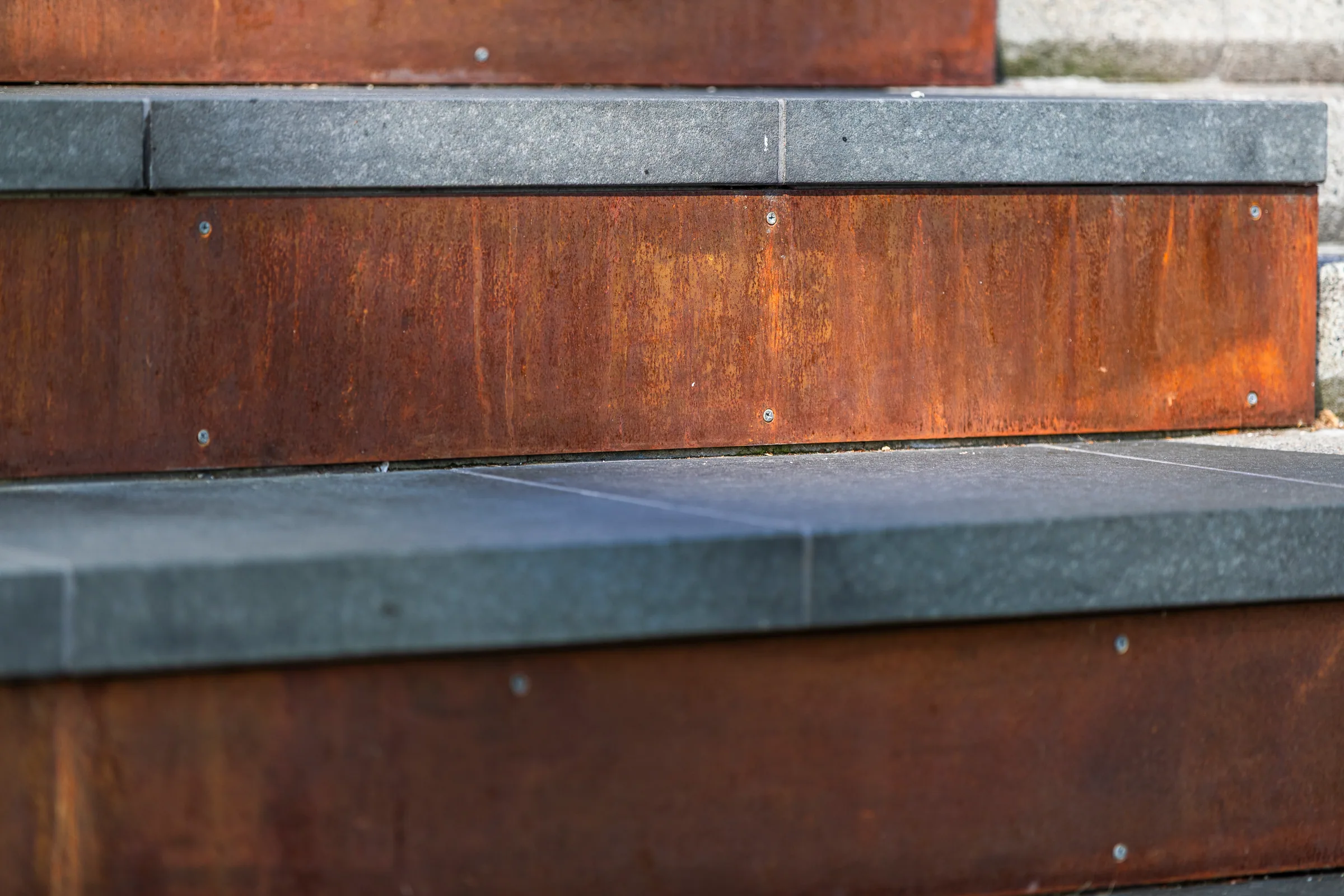 Close on steel risers under granite treads