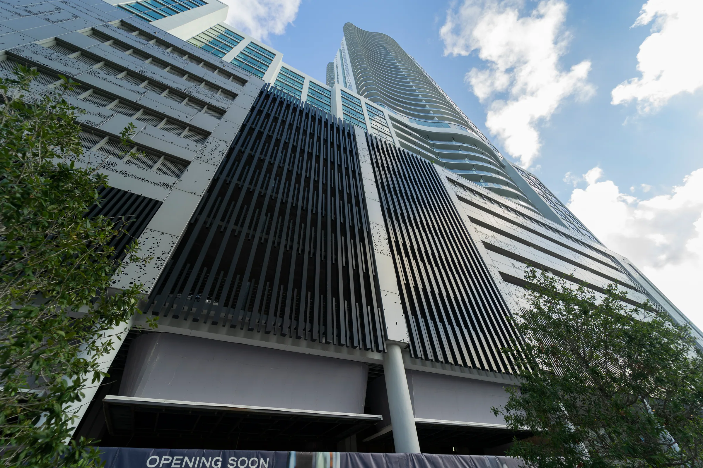 Looking up the tower past dark vertical fins