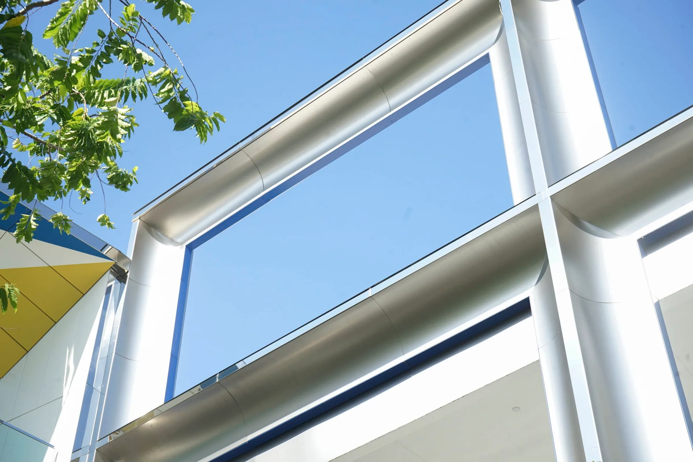 A stainless steel frame against a blue sky