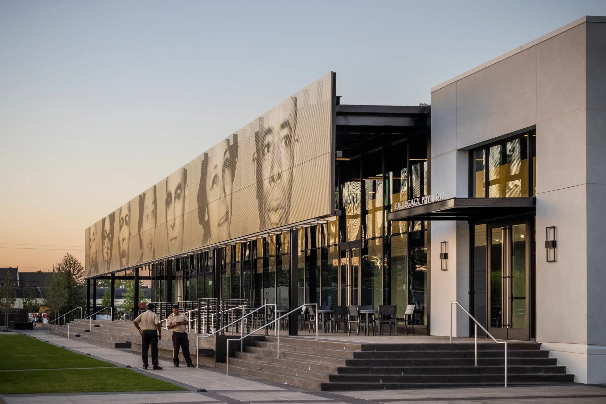The long portrait façade running back from a white building
