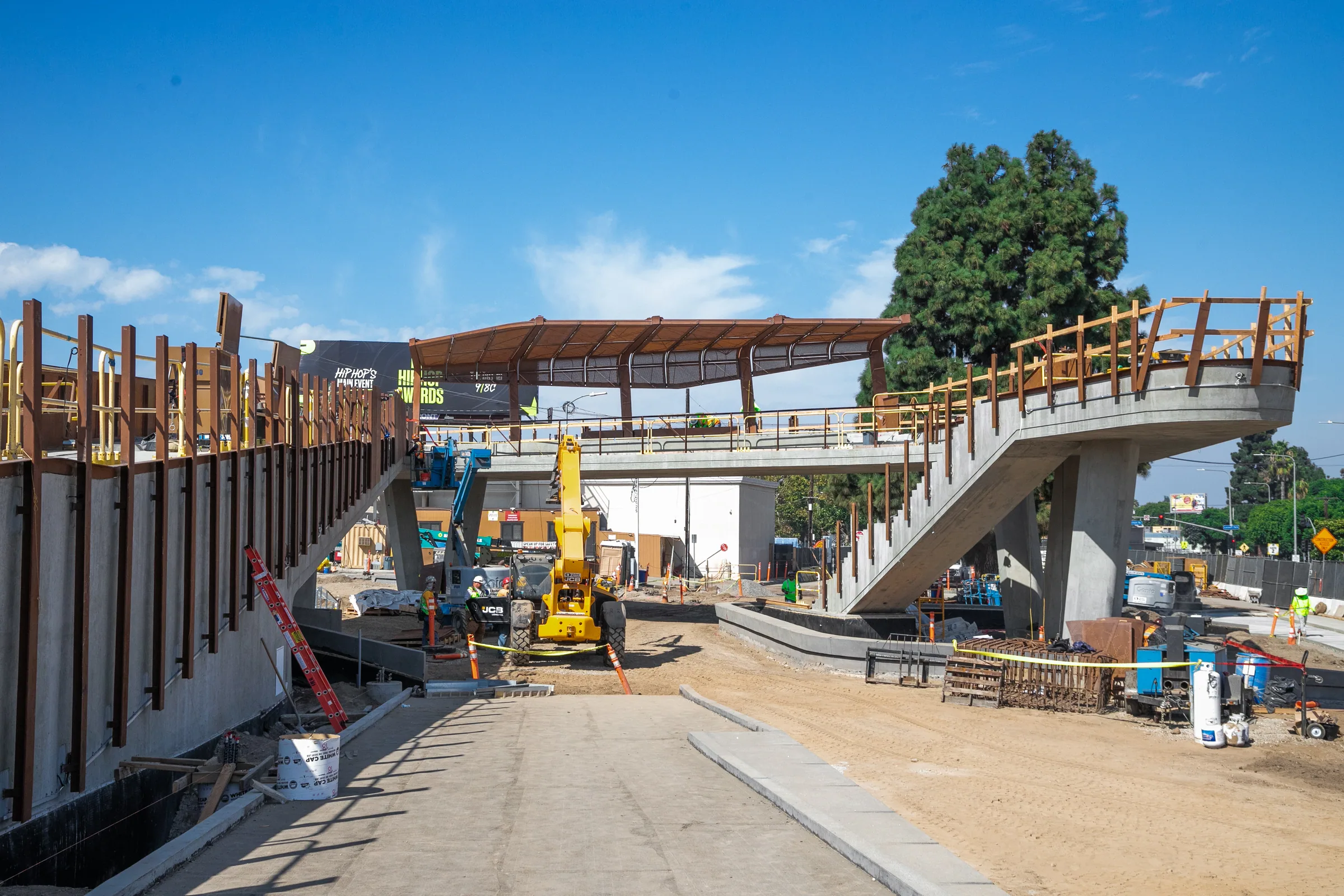 Looking down the site toward the canopy and a steel stair