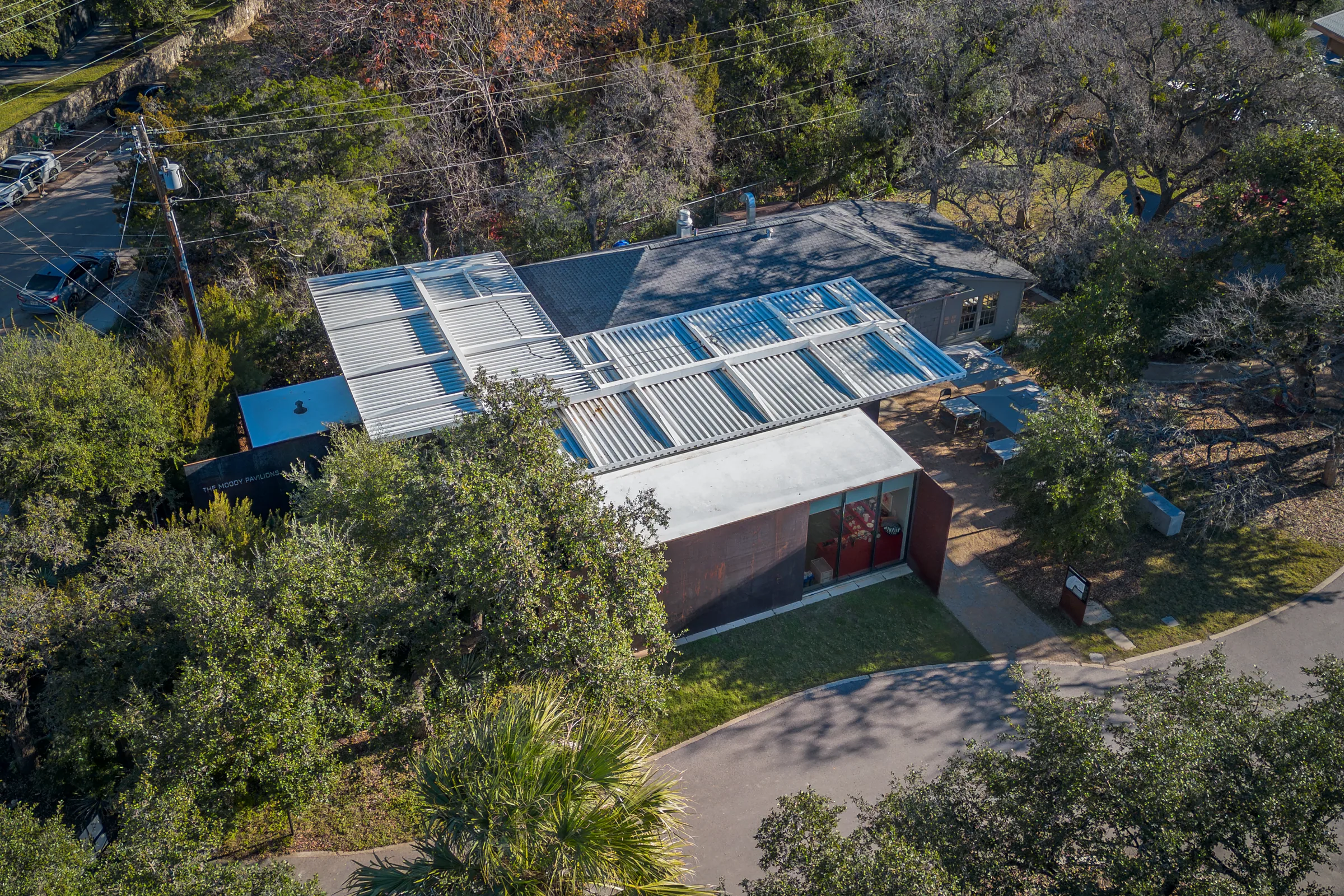 From above: the pavilion's white roofs among the trees