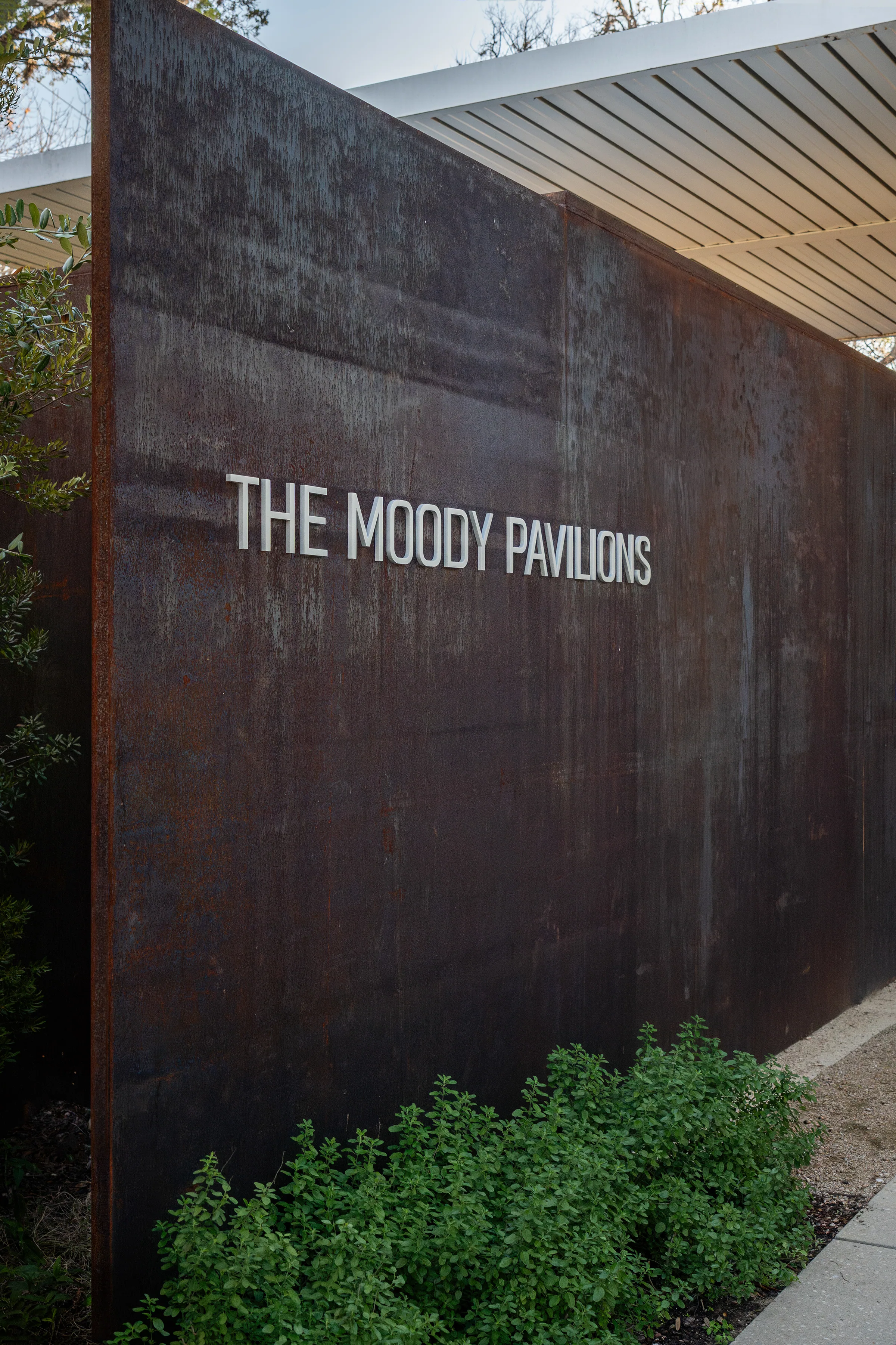 A steel wall lettered The Moody Pavilions