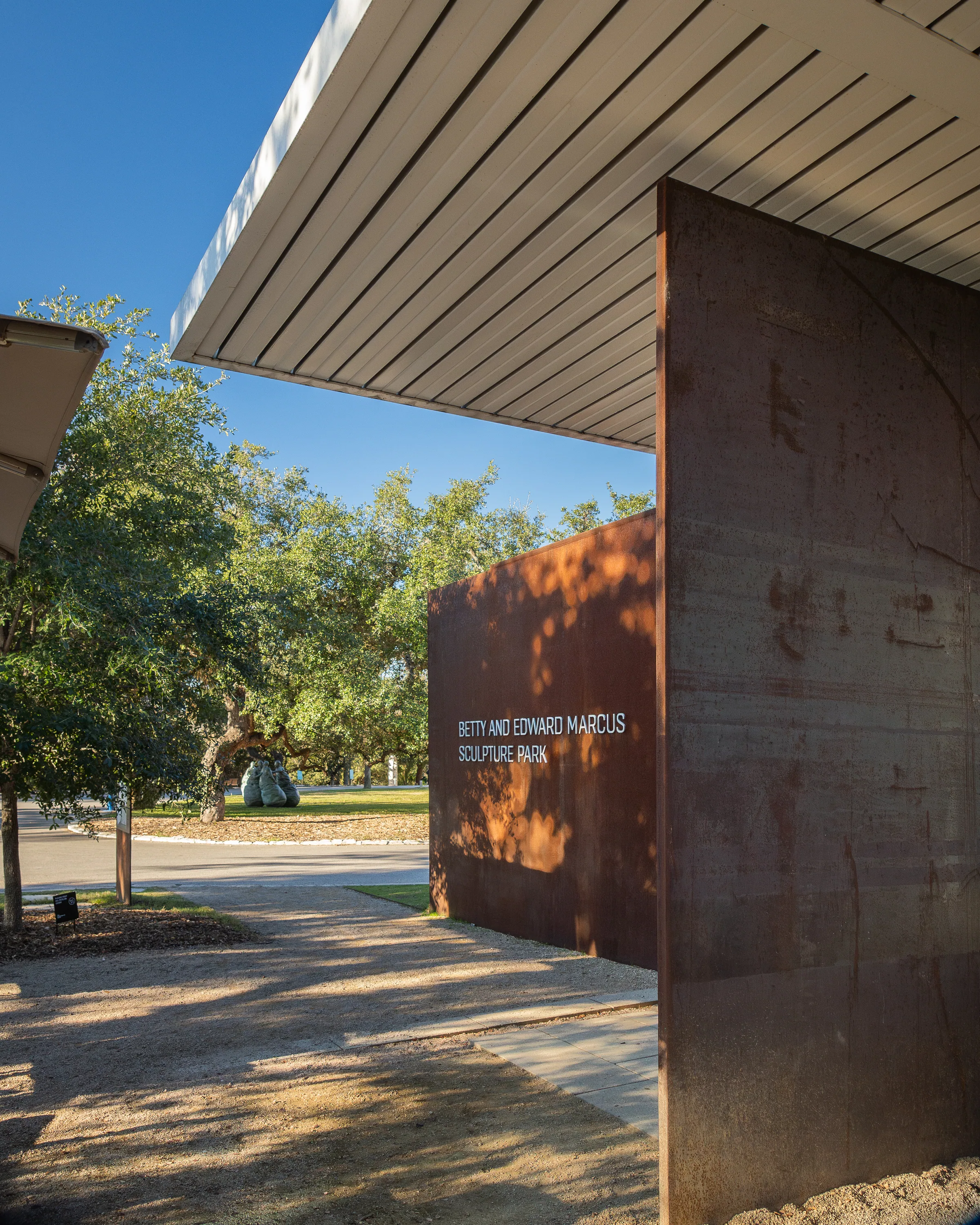 A steel plane beside the roof edge of a pavilion