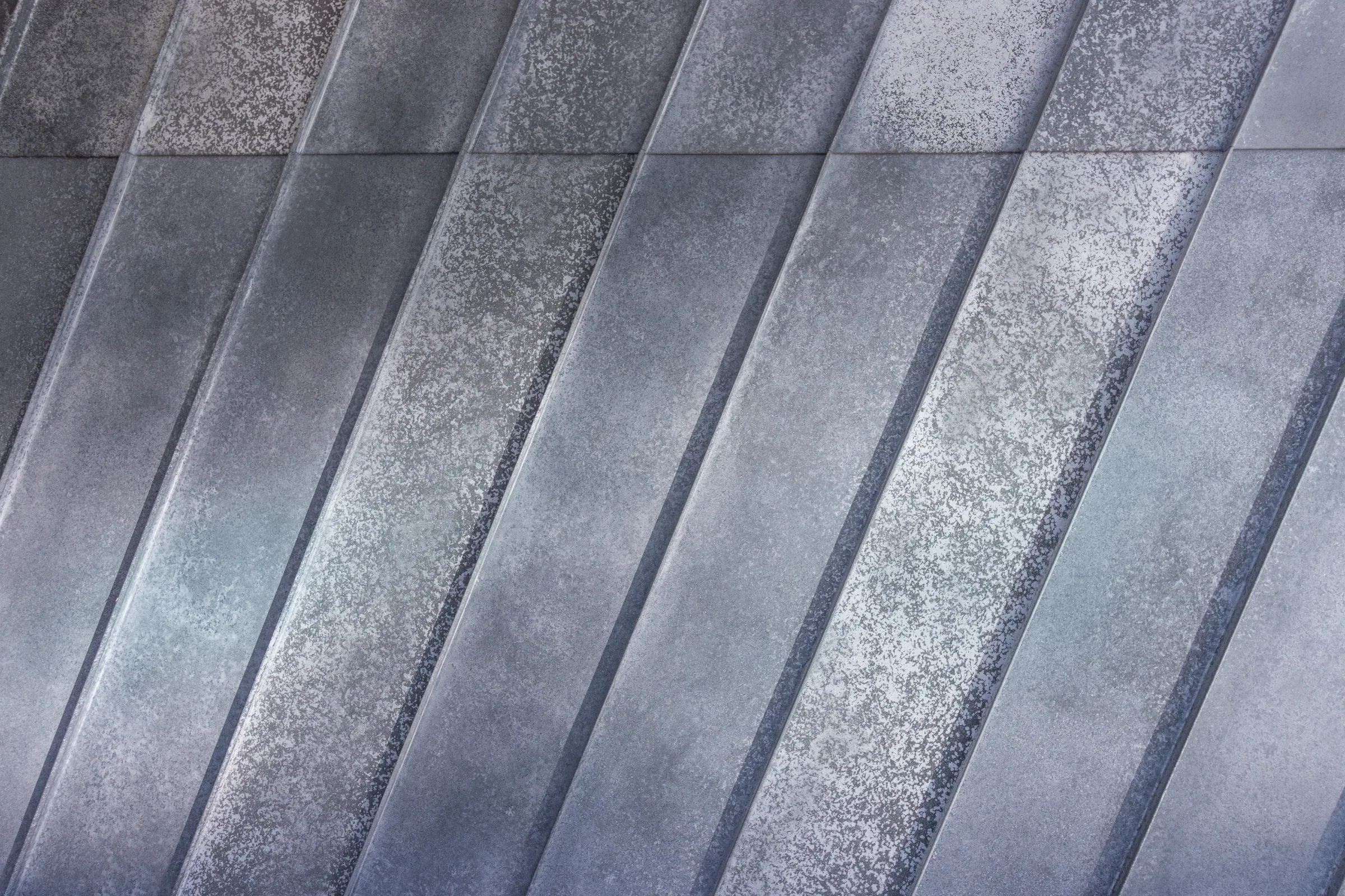 Weathered zinc panels with diagonal seams