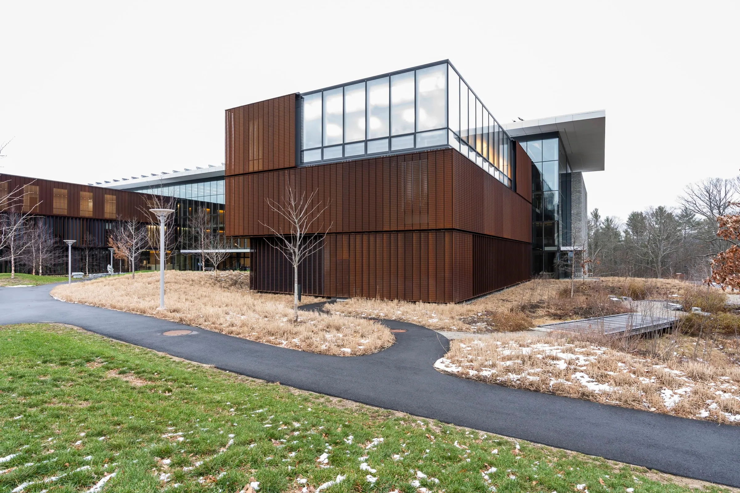 The building from a curving path in winter