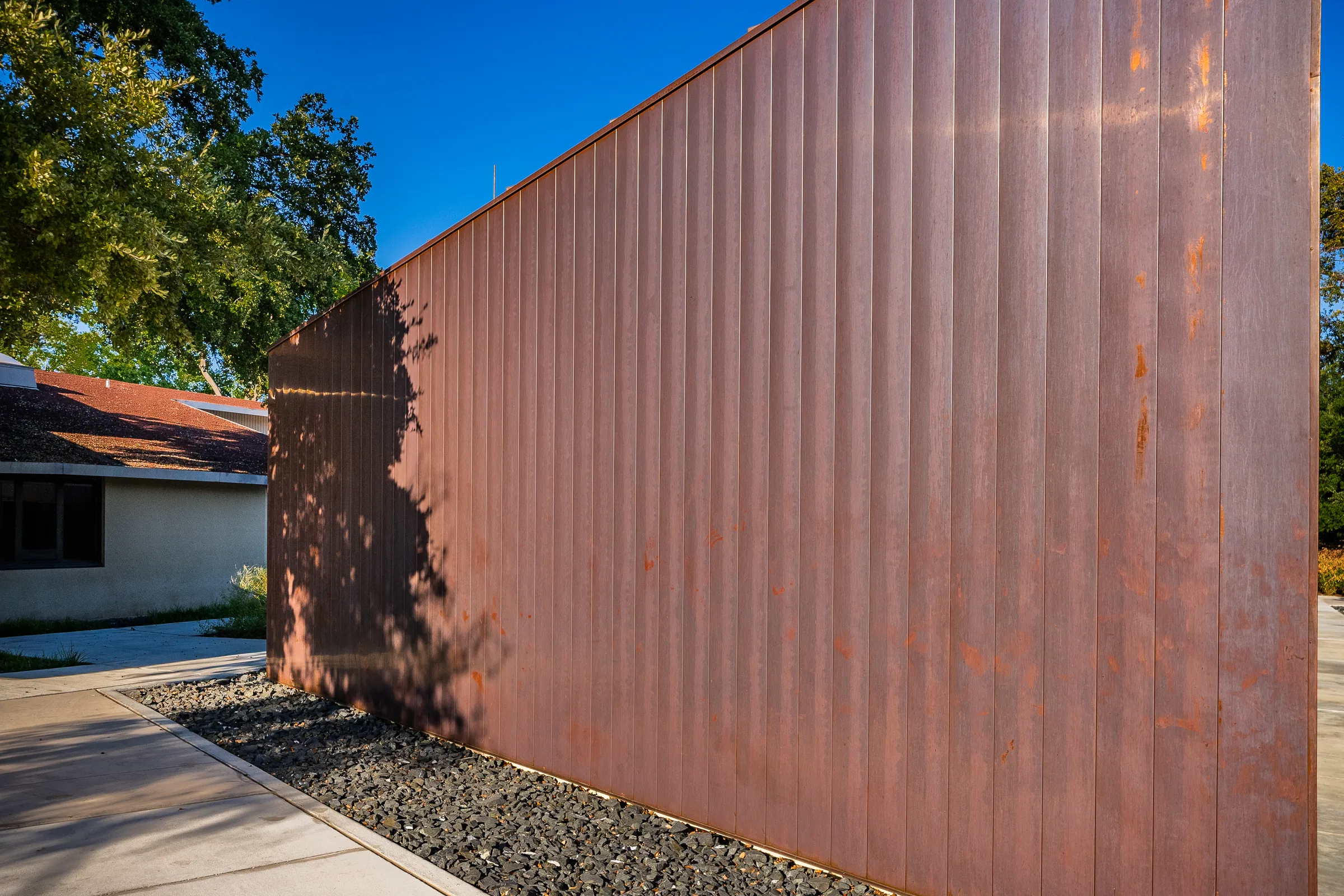 A wall of rippled copper panels