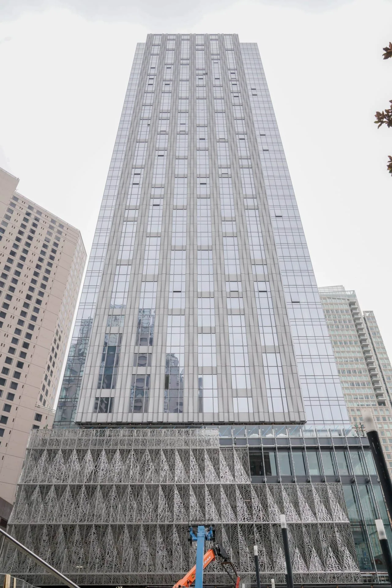 The tower rising above the museum’s steel screen