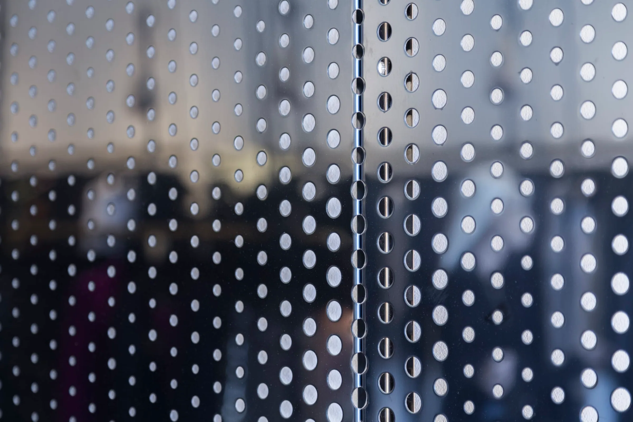 Light passing through the perforations, up close