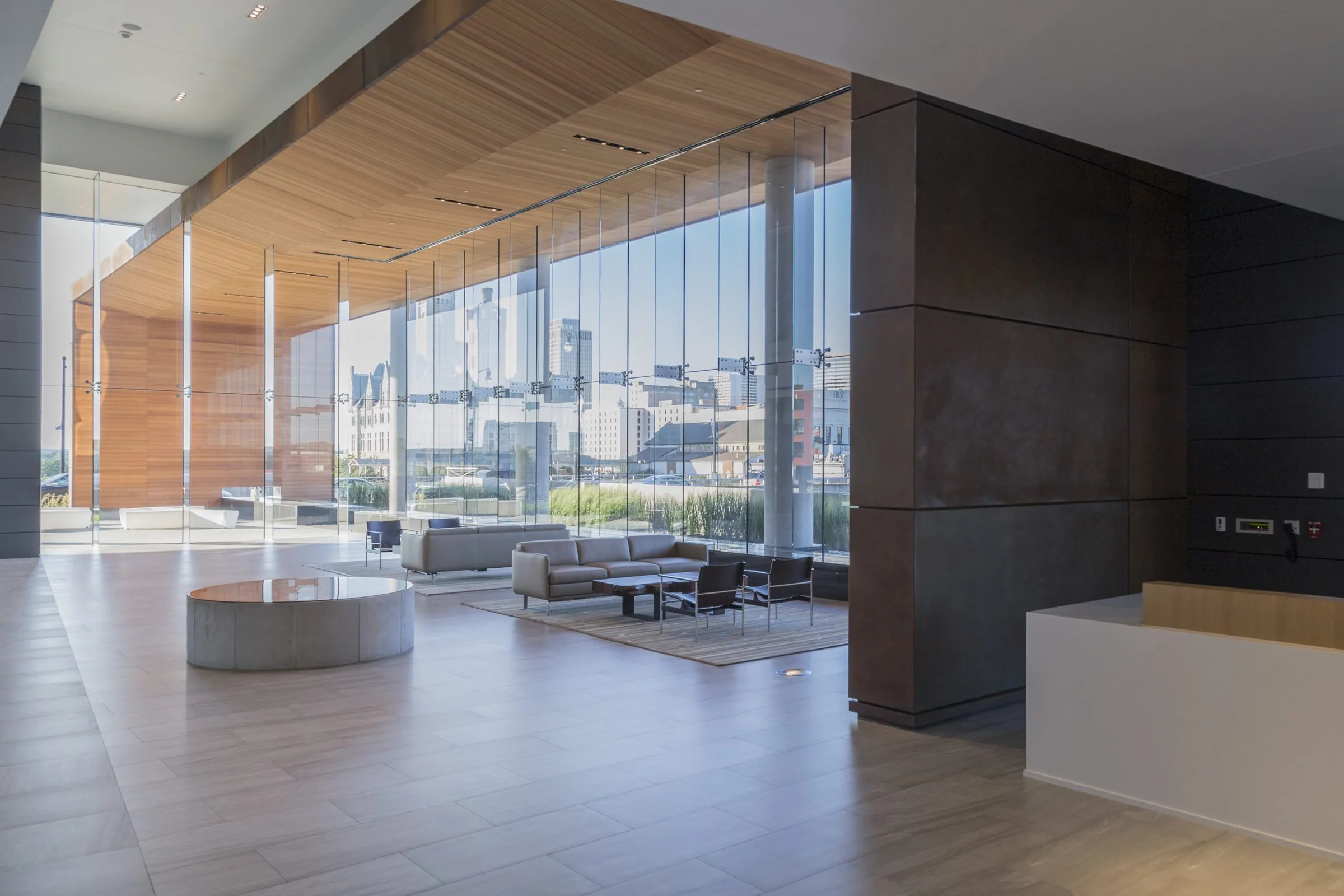 Inside the lobby, steel wall panels and a wood ceiling