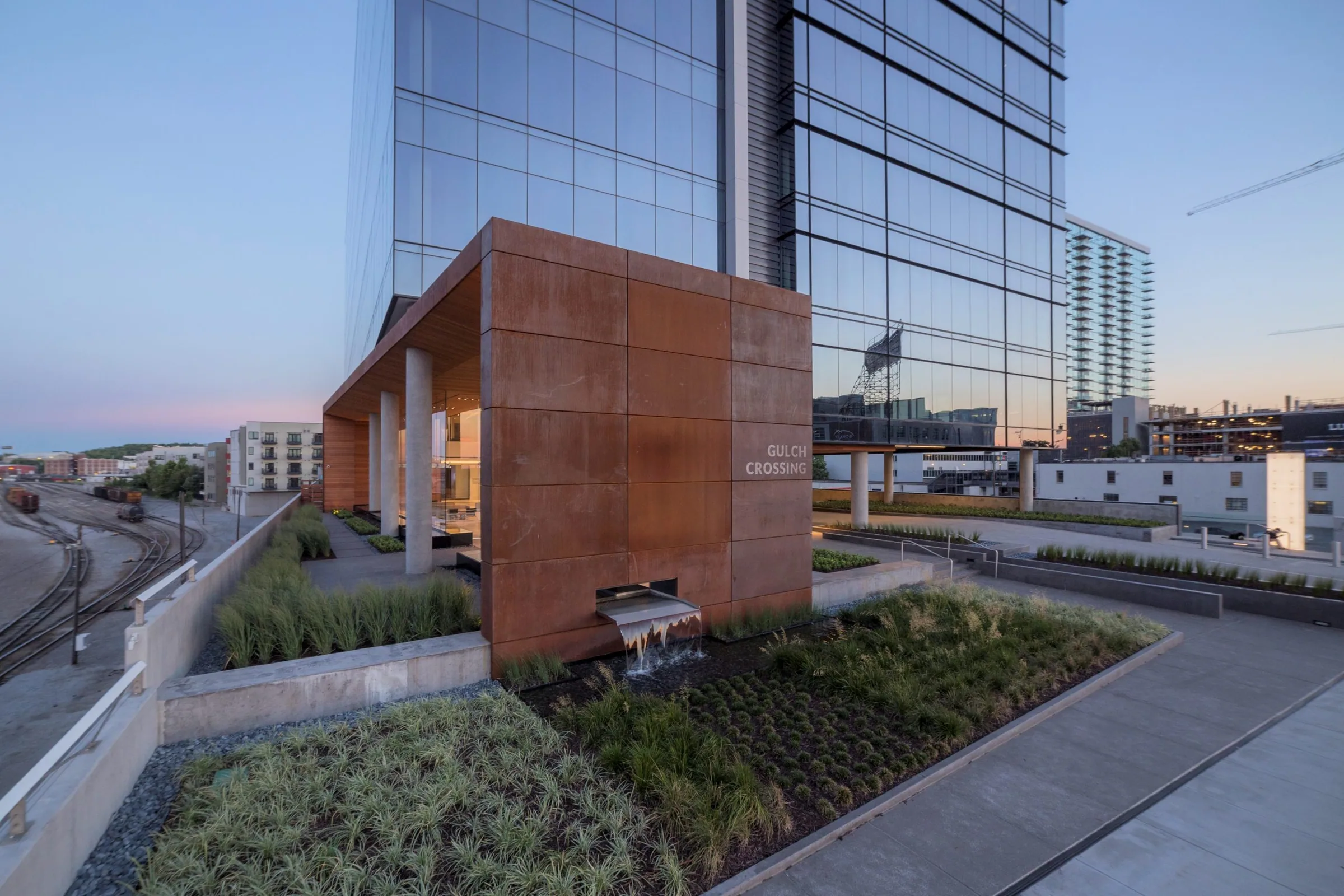 The steel canopy and planting at the building’s base