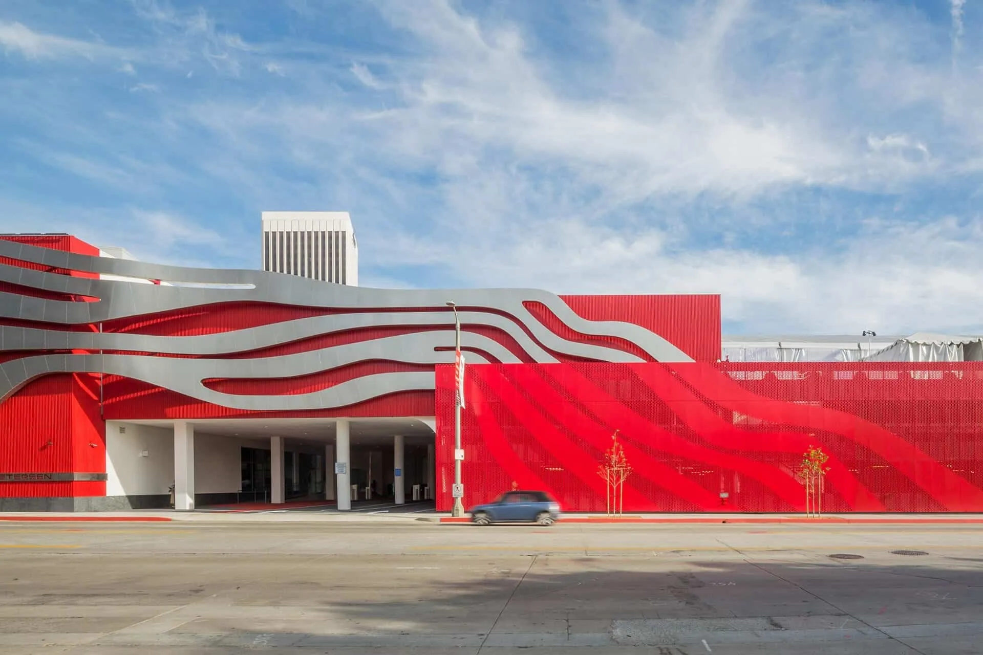 The red façade and the ribbons along the street