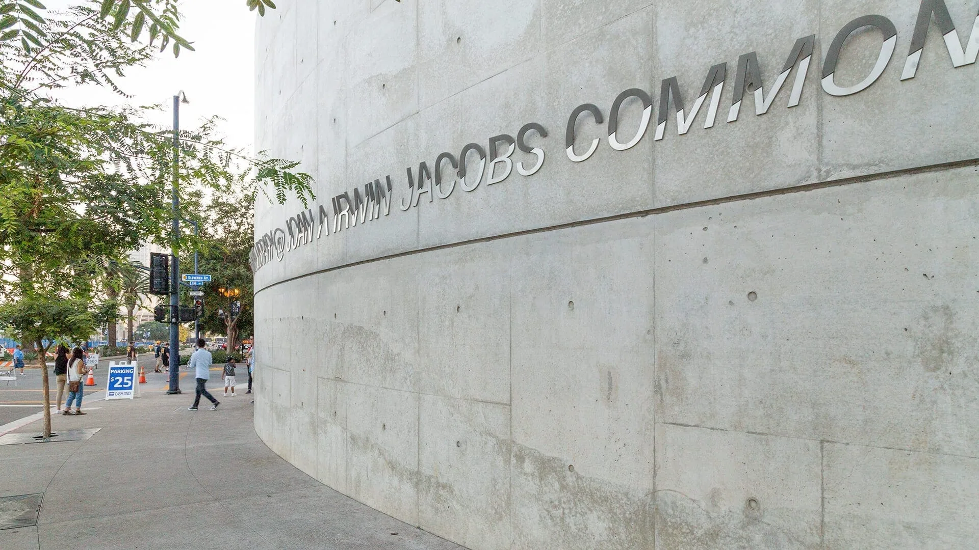 The Joan and Irwin Jacobs Common lettering on a curved concrete wall