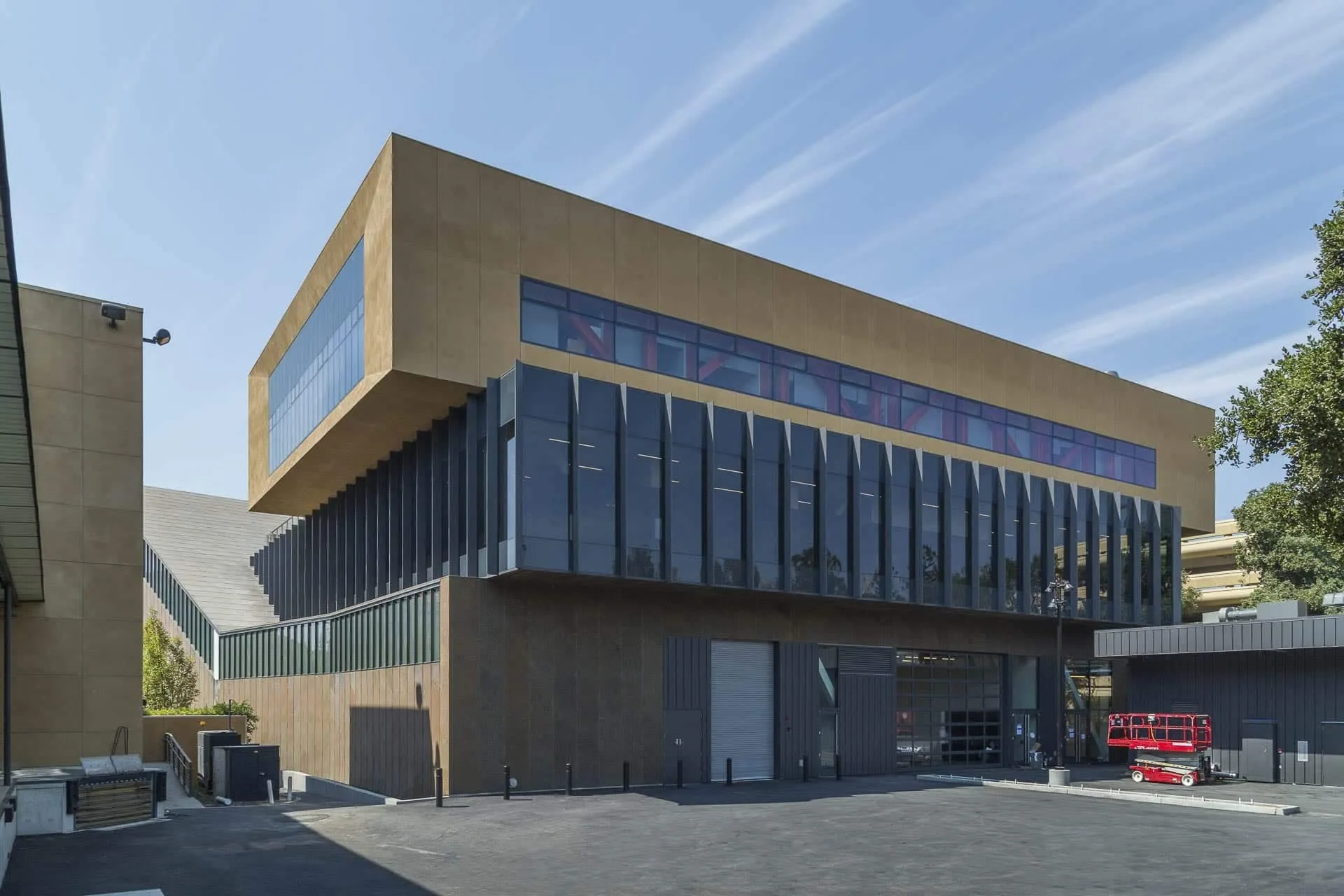 The building’s zinc upper floors and glass base from the street