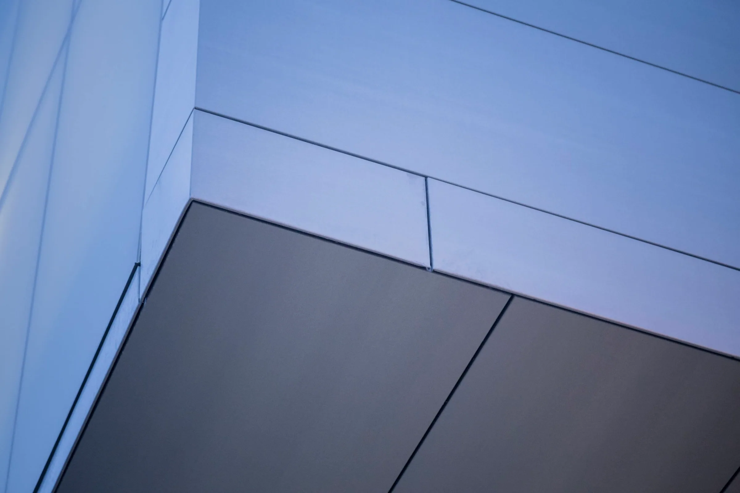 Zinc panels and a dark recessed band